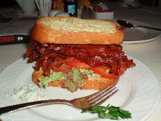 Brioche toast with blue cheese and lettuce and tomato and bacon and toast
